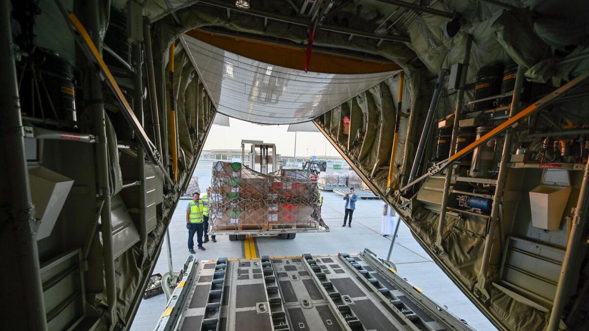 Relief items for Palestinians in Gaza are being loaded onto the plane at the Royal Air Wing in Dubai.