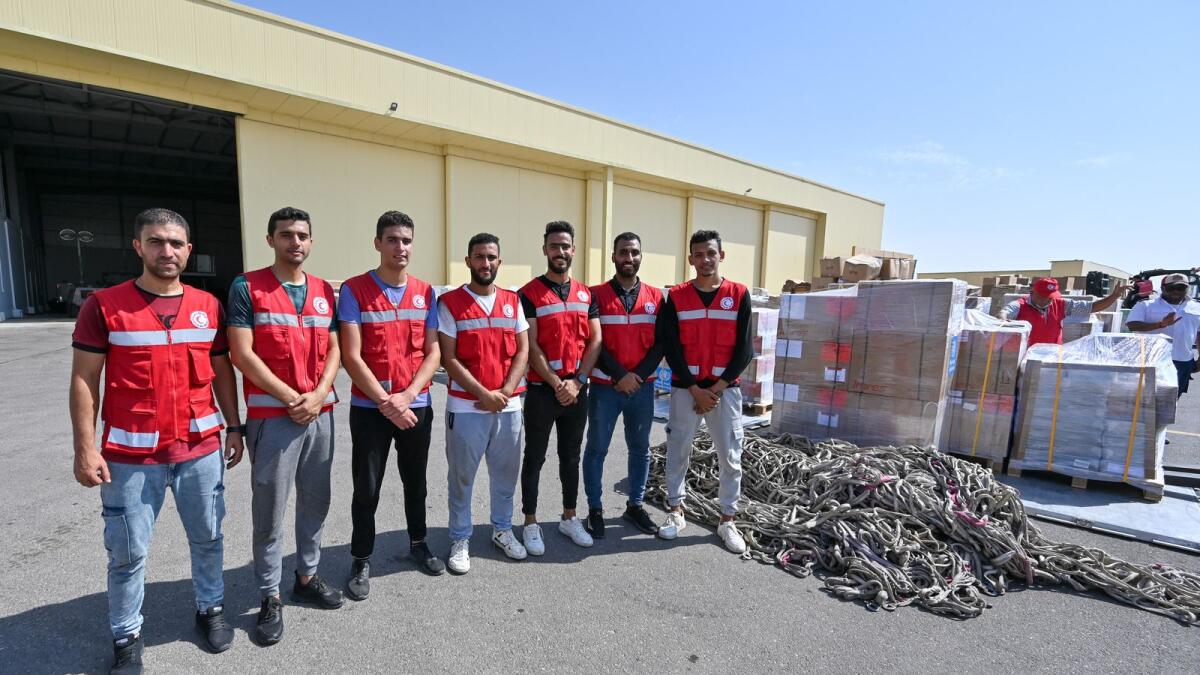 Team of Egyptian Red Crescent volunteers after unloading emergency relief materials received from Dubai at Al Arish Air Base in Egypt.