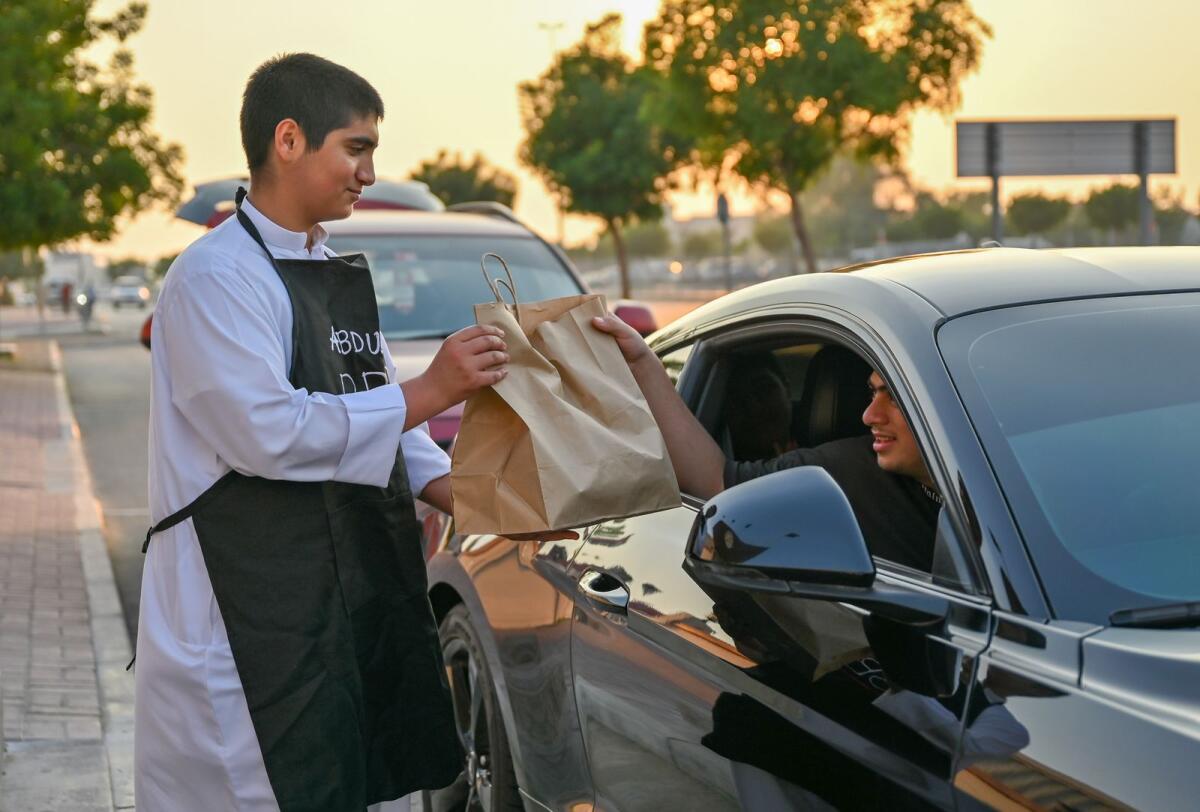 Abdulla AlJanahi delivers food to a customer in Dubai.  — Photo by M Sajjad