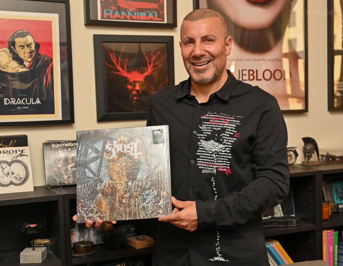 With signed vinyl record of Ghost's Impera album.