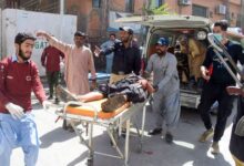 Volunteers carry a blast victim on a stretcher at a hospital in Quetta