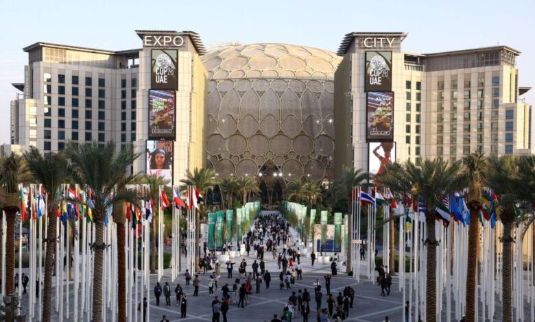 People walk at Expo City in Dubai during the United Nations Climate Change Conference (COP28).  - Reuters