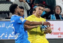 Al Nassr's Cristiano Ronaldo collides with Al Hilal's Ali Al Bulayhi before referee Mohammed Al Hoaish shows him a red card.  – Reuters